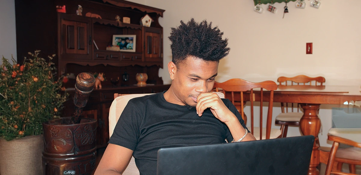 student thinking and studying at home